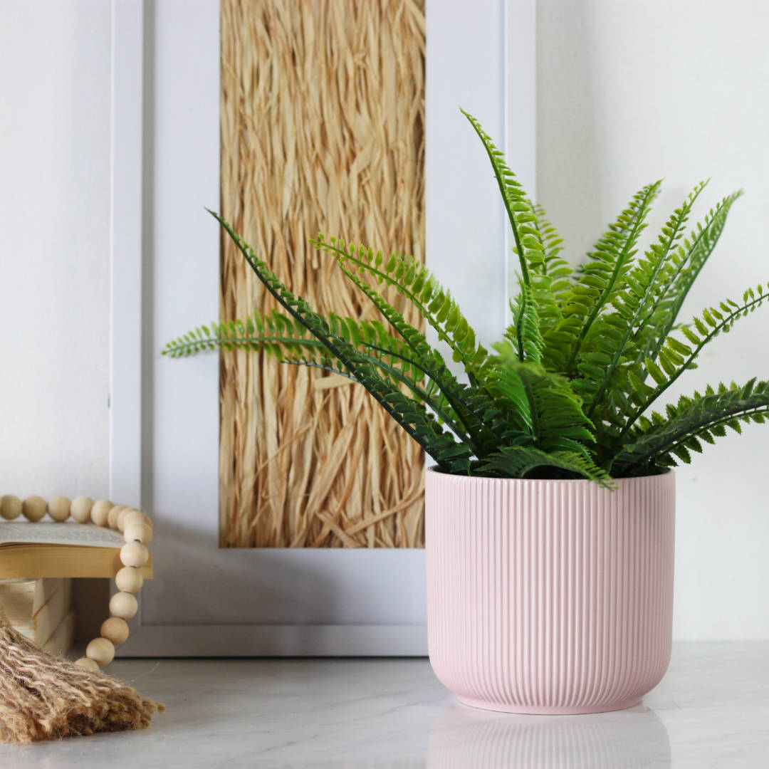 Pink ribbed plant pot